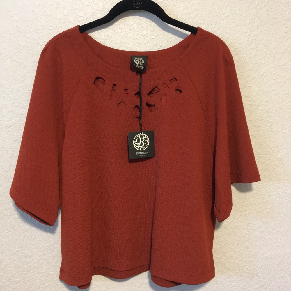Burnt orange top, cutouts around neckline - NWT!